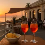 Quali sono i locali storici sul mare di Rimini per l’aperitivo? L’orario giusto per prendere posto vista tramonto